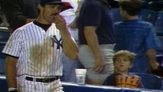 Don Mattingly helps himself to a young fans popcorn [upl. by Sato]